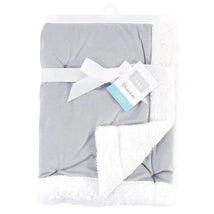Baby Vision Blanket in gray and white, featuring a soft Sherpa back, tied with a ribbon and a tag displaying product details.