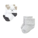 Baby Vision Grow With Me Socks set featuring a dog-themed design and a solid gray pair, suitable for infants.