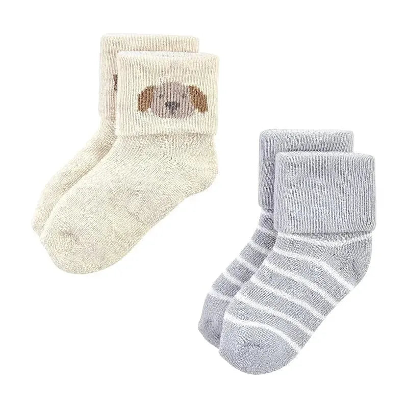 Soft, cozy socks in a pack of 12 featuring a beige pair with a dog graphic and gray-striped designs.