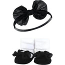 Gift set featuring a black lace bow headband and matching black and white baby socks with bows.