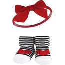 Red headband with a bow paired with black and white striped socks featuring red hearts.