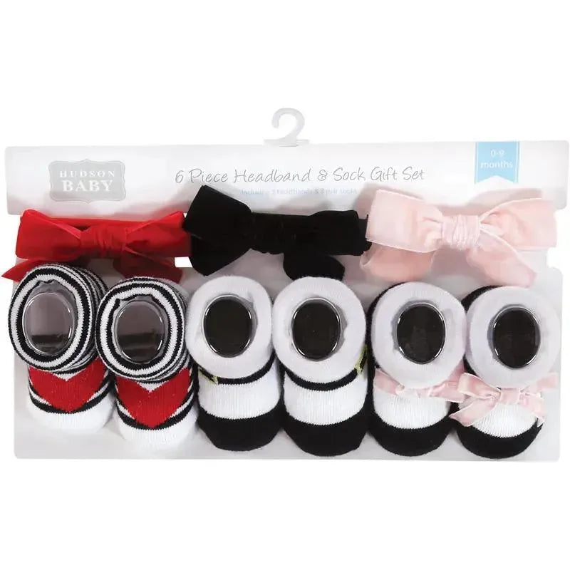 Six-piece headband and sock gift set for baby girls, featuring red, pink, and black colors with various bow designs.