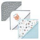Three hooded baby towels featuring playful designs: one with alphabet letters, another with a tiger graphic, and a third with animals.