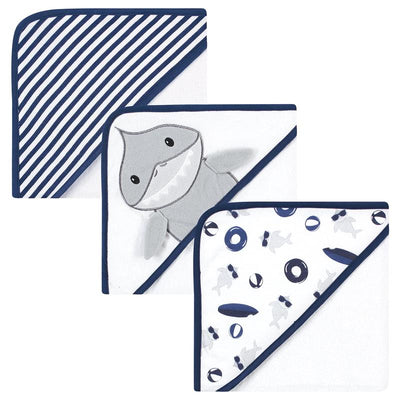 Three unisex baby hooded towels featuring a gray shark design, striped patterns, and playful shark illustrations, in soft cotton.