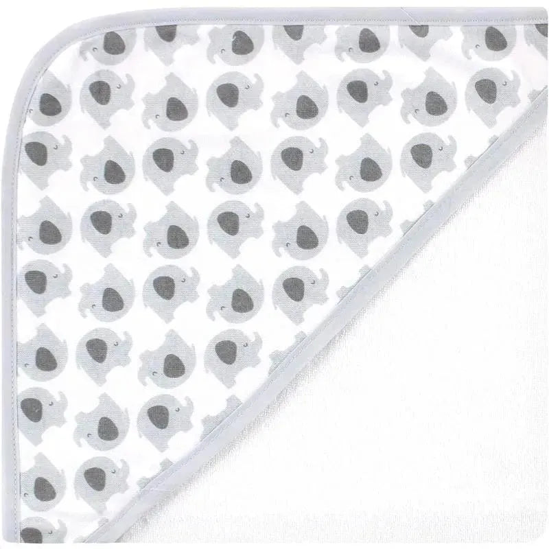 Hooded baby towel with gray elephant prints and white dots, designed for drying and keeping infants cozy.