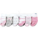 Ballerina-themed newborn socks in pink and gray, featuring various patterns, packaged in an 8-pack for baby girls aged 6-12 months.