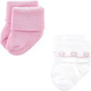 Ballerina-themed newborn socks for baby girls, pink and white with a fold-over design, suitable for ages 6-12 months.