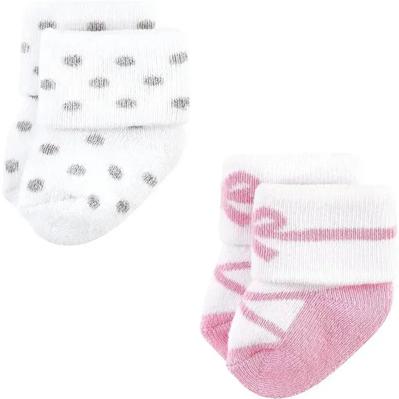 Ballerina-themed newborn socks for baby girls in pink and white, featuring polka dots and ballet motifs. 8-pack for ages 6-12 months.