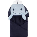 Hooded towel shaped like a smiling whale with a sailor hat, designed for unisex babies.