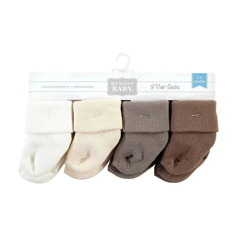 Eight pairs of baby socks in soft beige and brown tones, designed for infants aged 0-6 months, packaged neatly.