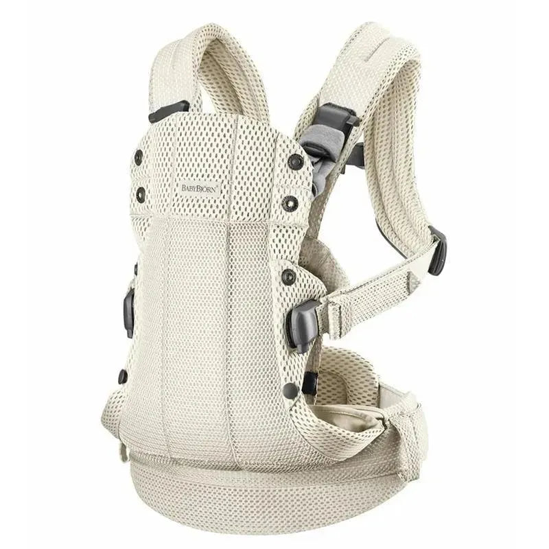 BabyBjorn Baby Carrier Harmony in cream color made of breathable 3D mesh, featuring adjustable straps and secure buckles.