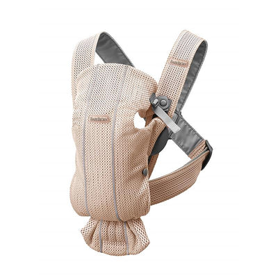 BabyBjörn Baby Carrier Mini in 3D mesh, colored pearly pink, designed for carrying infants comfortably.