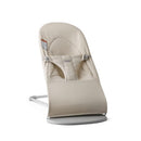 Adjustable BabyBjörn Bouncer Balance Soft in light beige, featuring harness and breathable fabric seat.