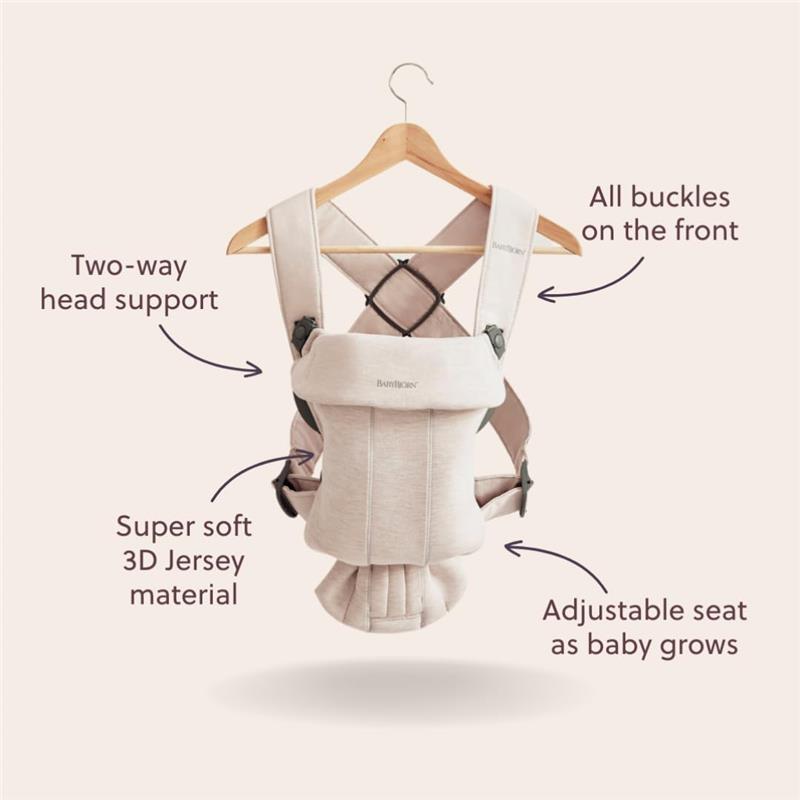 Babybjorn Carrier Mini in Light Beige features two-way head support, adjustable seat, and soft 3D Jersey material, displayed on a hanger.