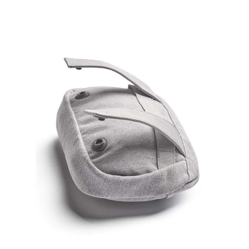 Light gray BabyBjörn Pocket Pouch for baby carrier, featuring adjustable straps and button closures.