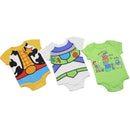 Three Toy Story-themed baby bodysuits: yellow Woody design, white Buzz Lightyear design, and green playful text design.
