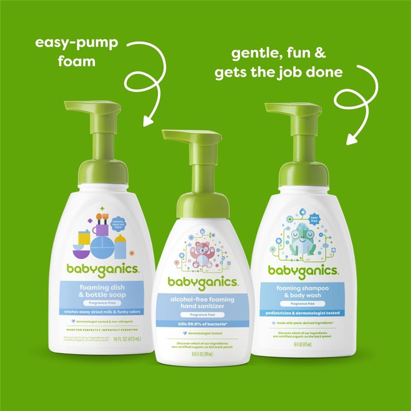 Babyganics Baby Shampoo + Body Wash, fragrance-free, 16 oz, displayed with foaming dish soap and hand sanitizer on a green background.