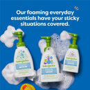 Babyganics foaming shampoo and body wash, foaming dish soap, and alcohol-free hand sanitizer with green pumps on a blue background.