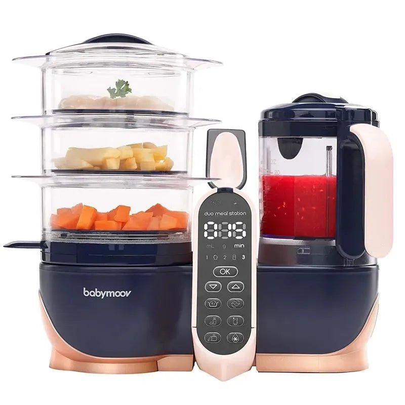 Babymoov Duo Meal Station XL, a 6-in-1 food processor with three steaming compartments, a blender, and control panel.