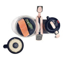 Duo Meal Station XL food processor with salmon fillet, herbs, and rice steaming insert on a dark base.