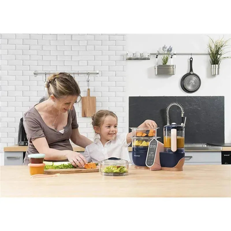 Mother and child using the Babymoov Duo Meal Station XL food processor, chopping vegetables, and preparing fresh meals together in a modern kitchen.