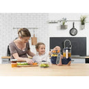 Mother and child using the Babymoov Duo Meal Station XL food processor, chopping vegetables, and preparing fresh meals together in a modern kitchen.