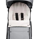 Footmuff for Babyzen Yoyo stroller in stone color, featuring soft white lining, black straps, and a sleek gray exterior.
