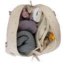 Bbluv Doudoune Changing Bag opened to reveal interior items including soft towels, wipes, and baby essentials.