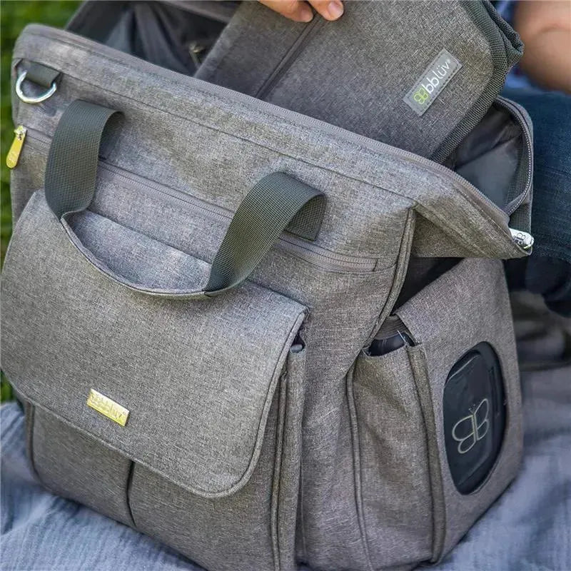 Charcoal Bbluv Metrö Complete Backpack Diaper Bag with multiple pockets and a textured fabric, partially open with an inner organizer visible.