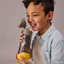 Boy drinking from a BBoox Batman-themed Tritan water bottle with straw, soft yellow base, and gray cap, size 600ml.