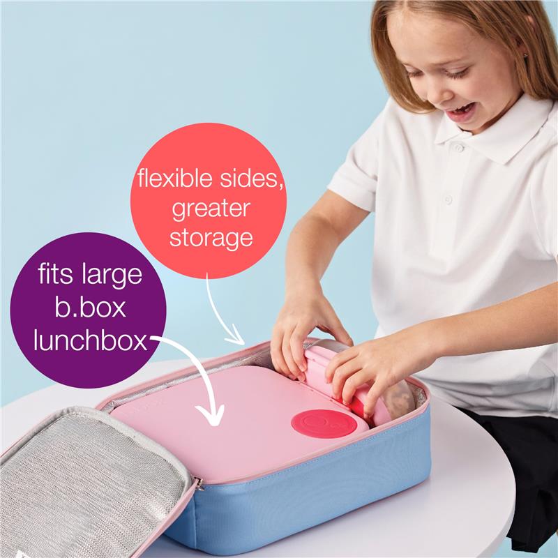Bbox Batman Flexi Insulated Lunch Bag being packed with a large pink lunchbox, featuring flexible sides for greater storage.