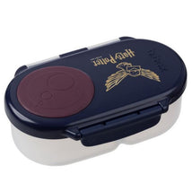 Harry Potter-themed snackbox featuring a navy blue design with a gold logo and a maroon round lid.