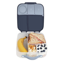 Bbox Lunchbox in Midnight color, featuring a sandwich, banana, popcorn, yogurt with blueberries, and divided compartments.