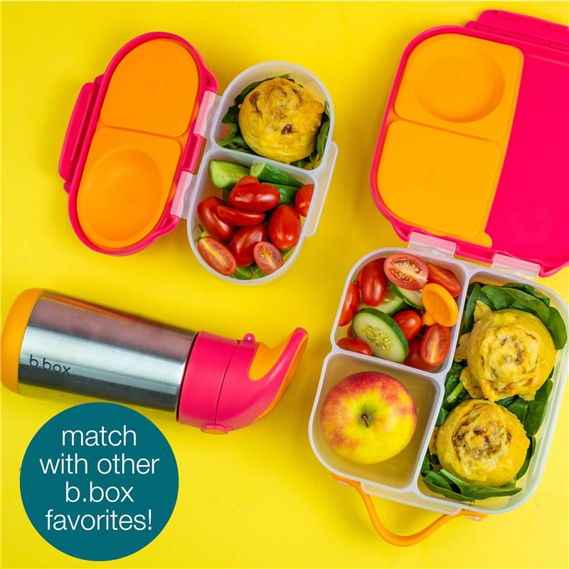 Mini lunch box for kids in Blush Crush color with compartments holding food items, accompanied by a matching drink bottle.