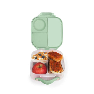Mini lunchbox in spearmint color, containing an apple, yogurt with granola and berries, and two pieces of baked dish.
