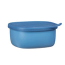 Silicone lunch tub in ocean blue, featuring a secure lid and rounded design, perfect for food storage.