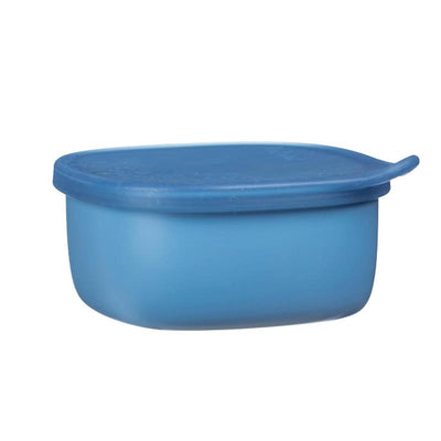 Silicone lunch tub in ocean blue, featuring a secure lid and rounded design, perfect for food storage.