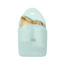 Silicone sandwich pocket in a light green color, holding two wrapped sandwiches with visible ingredients.