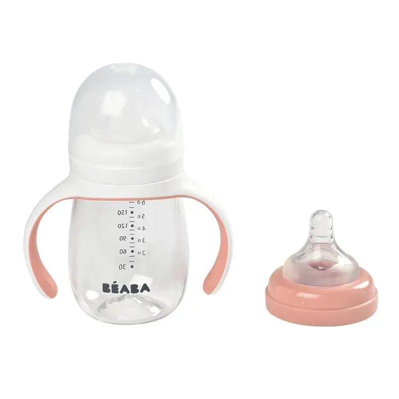 Beaba 2-in-1 Bottle to Sippy Learning Cup in rose, featuring a transparent body, measurement markings, and removable soft spout.