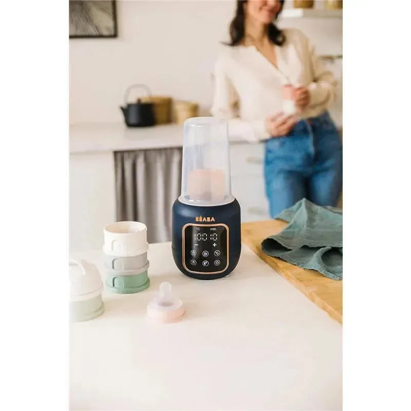 Beaba 5-in-1 Multi Milk Baby Bottle & Food Warmer in Midnight color, with visible control panel, surrounded by baby bottles.