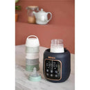 5-in-1 Beaba Multi Milk Baby Bottle & Food Warmer in midnight color, with digital display, surrounded by baby bottles and containers.
