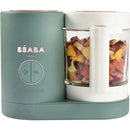 Beaba Babycook Neo in eucalyptus color, featuring a glass bowl filled with chopped fruits, for easy baby food preparation.