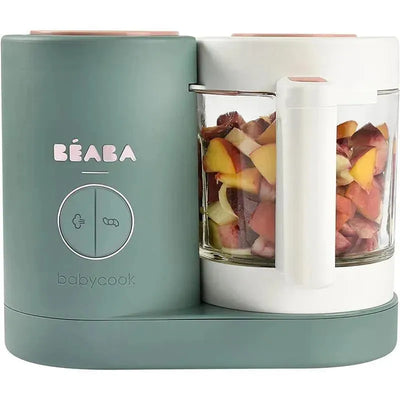 Beaba Babycook Neo in eucalyptus color, featuring a glass bowl filled with chopped fruits, for easy baby food preparation.