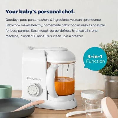 Beaba Babycook Solo 4-in-1 Baby Food Maker in rose gold, with a blending jar containing orange puree, and a 4-in-1 function badge.