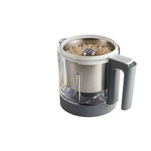 BEABA Rice, Pasta and Grain Pro Insert Food Mill in white, featuring a steel top and transparent bowl with rice inside.