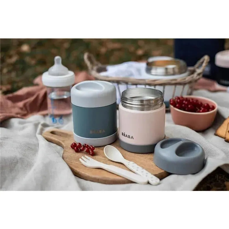 10oz stainless steel insulated food jar by Beaba in eucalyptus color, alongside a matching lid, utensils, and a water bottle.