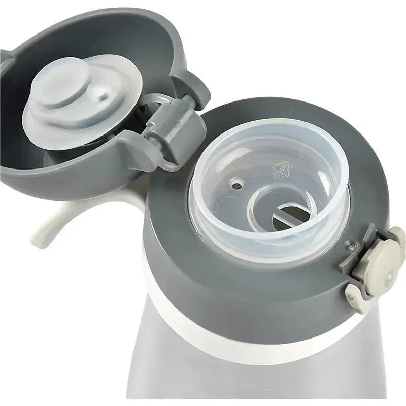 Stainless steel kids water bottle in charcoal color with an open lid revealing a straw and silicone valve.