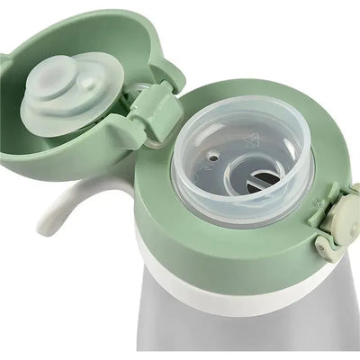 Stainless steel kids water bottle by Beaba, featuring a sage green lid with a flip top and spout for easy sipping.
