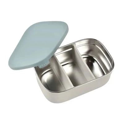 Stainless steel lunch box by Beaba in rain color with a removable light blue lid and three inner compartments.