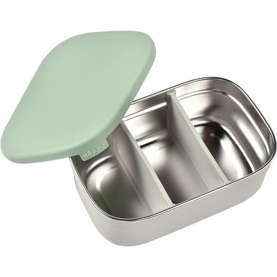 Beaba Stainless Steel Lunch Box in sage color, featuring a green silicone lid and divided compartments inside.